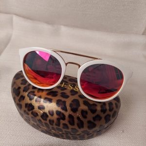 Woman's Guess, white framed  sunglasses w/ aerodescent lenses. Original case inc